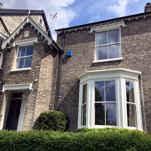exterior shot of restored sash windows front of suffolk property