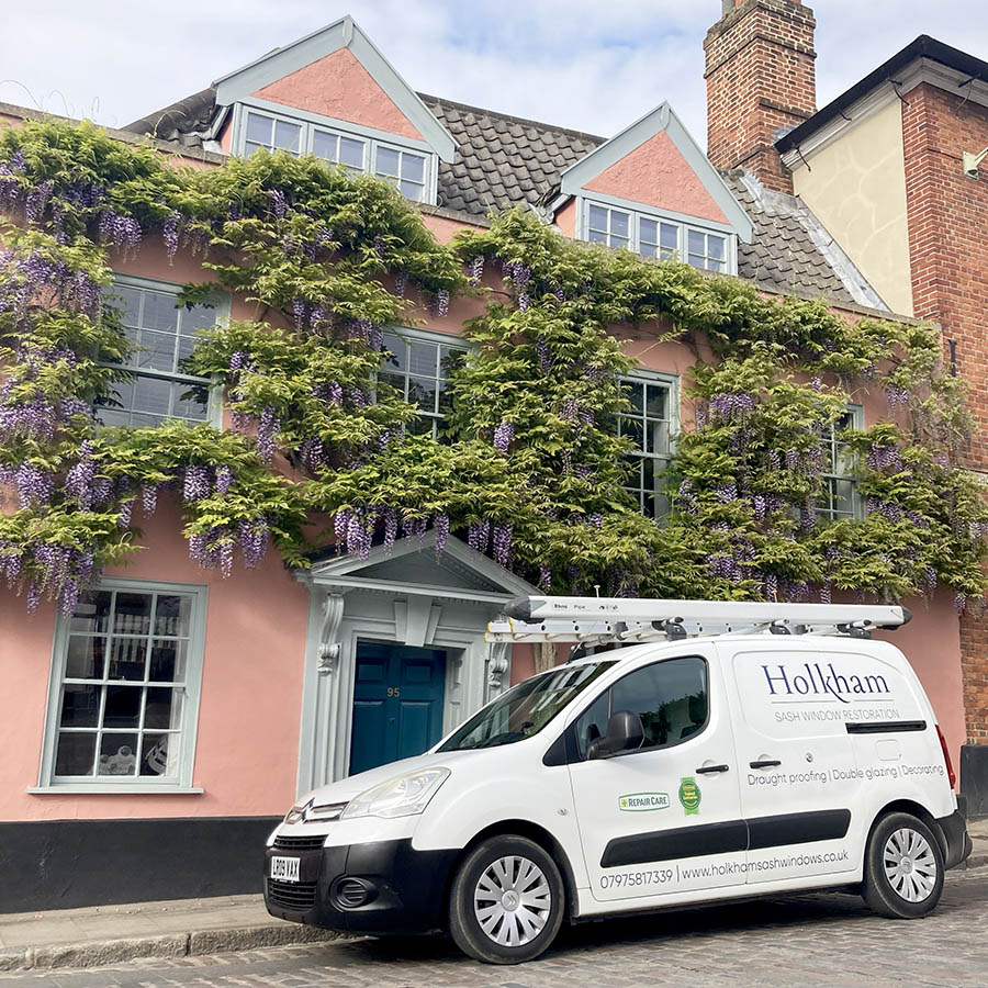 holkham sash window restoration company van outside recently repaired property